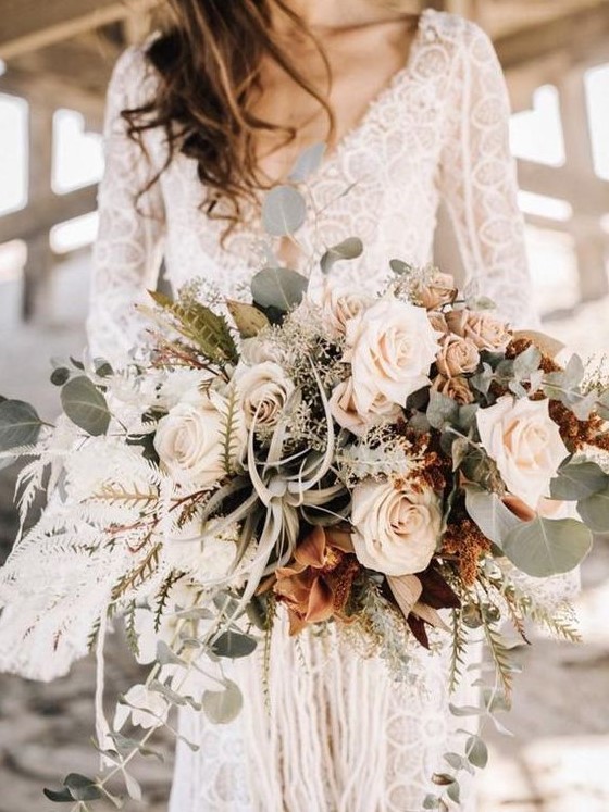 a sophisticated blush wedding bouquet with white touches, pale greenery and air plants for a beach bride