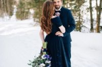 a stunning navy off the shoulder wedding dress with a lace applique skirt