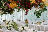 a super lush and super bright floral installation over the reception tables will make a gorgeous statement
