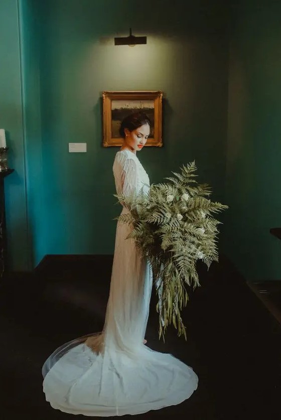 a super lush fern wedding bouquet with white blooms plus some cascading elements will be a nice idea for a vintage NYE bride