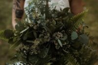 a super lush greenery wedding bouquet of ferns, two types of eucalyptus is a very pretty and cool idea for a woodland bride