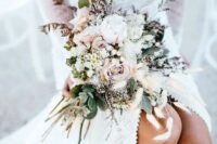 a sweet and ethereal late summer bouquet in blush and creamy tones, with greenery, herbs and spikes