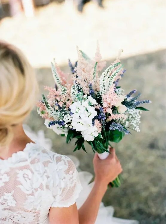 a tender pastel bouquet in white, blush and with lavender plus a very interesting shape