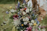 a textural and colorful wildflower wedding bouquet with a lot of dimension and texture is amazing for a summer boho bride