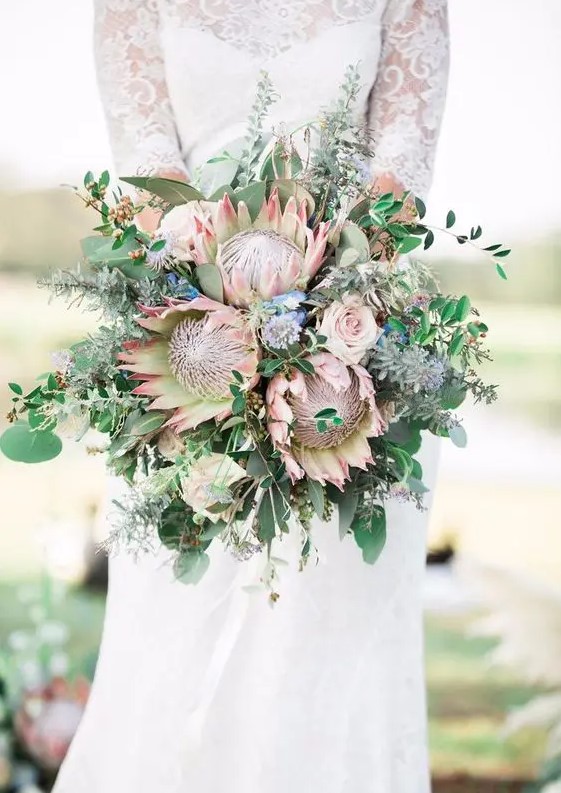 a textural wedding bouquet with king proteas, eucalyptus and greenery for a boho bride