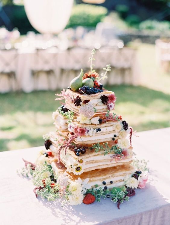 a waffle wedding cake with fresh blooms, berries and pears on top is a lovely idea for a summer boho wedding