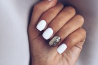a white manicure with a gold glitter accent nail is a timeless and stylish idea to rock for a winter or other bridal look