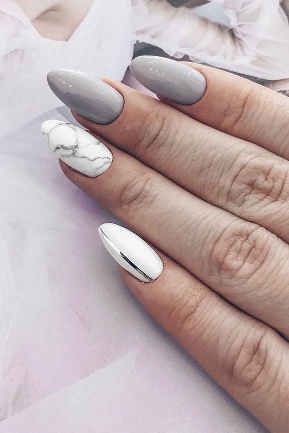 a white nail with a shiny silver stripe, a white marble nail and grey nails for a glam and chic bridal look