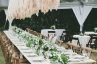 an amazing overhead wedding installation of pampas grass to add an edgy touch