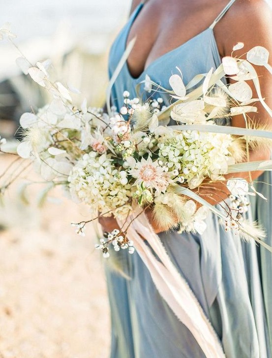 an ethereal and textural wedding bouquet with pastel and neutral blooms and dried touches