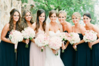 black strapless maxi gowns with draped bodices and a matching blush one for the maid of honor