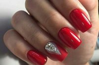 bold red nails with a geometric rhinestone touch for a winter holiday wedding