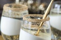 champagne jello cups in glasses with edible gold glitter edges are delicious refined wedding desserts for a NYE wedding