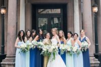 cobalt and light blue plus navy maxi gowns for the bridesmaids and a gold sequin one shoulder maxi dress for the maid of honor