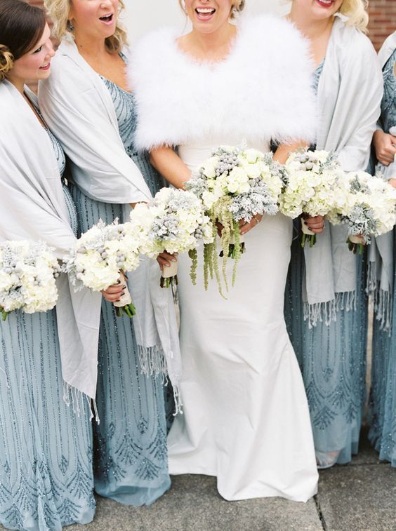 dove grey pashminas with fringe match the blue dresses and keep the girls warm and comfortable