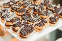 eclaires with vanilla and chocolate sprinkes on top are fresh, tasty and amazing