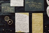 gorgeous black and white wedding stationery with touches of gold and calligraphy