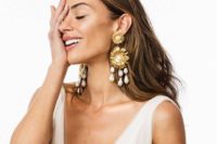 gorgeous statement gold flowers and usual and baroque pearl earrings will make a statement in any bridal look