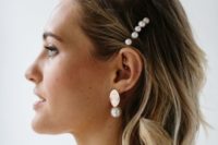 large pearl hair pins and cool modern gold and pealr earrings will be a bold statement for a bride
