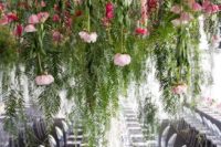 lush foliage, pink and hot pink blooms hanging down make the monochromatic reception pop up with color