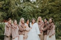 matching faux fur coats will keep your bridesmaids warm during a winter wedding, choose a white one for yourself