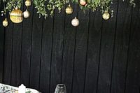 mixed metallic Christmas ornaments over the tablescape and in the table runner make the reception holiday-like
