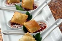 ravioli and tomato sauce plus herbs for a tasty vegan appetizer with a warming up effect