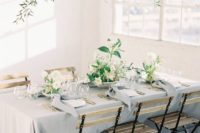 such a natural greenery, branch and white bloom wedding installation is a great idea for a garden feel indoors