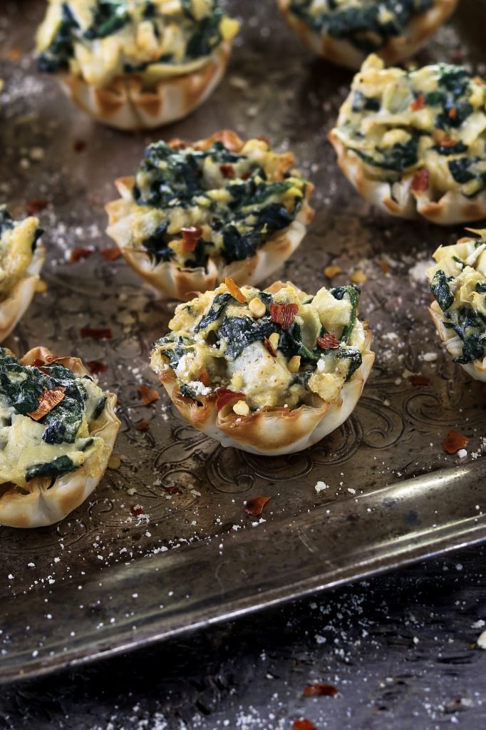 vegan spinach artichoke cups are a crowd favorite tucked inside a crispy and flaky shell