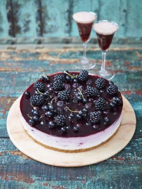 a black currant ombré cheesecake topped with fersh currant and blackberries is a decadent dessert that will make you excited