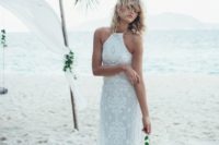 a boho lace wedding dress with a halter neckline and a lace skirt for a beach boho wedding
