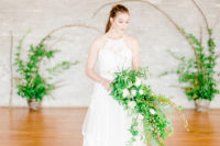 a chic halter neckline A-line wedding dress with a lace insert and a small lace train for a romantic bride