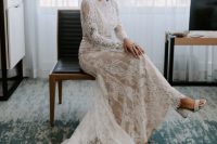 a creamy lace wedding dress with long sleeves, a high neckline, a trian and white block heels is ideal for an Old Hollywood wedding