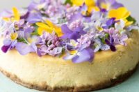 a creamy lemon cheesecake with vanilla wafer crust topped with fresh blooms is a cool idea for summer