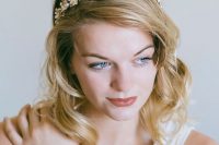 a delicate gold and crystal flower bridal crown will give a romantic and chic touch to your bridal look