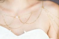 a gold and bead shoulder chain is a very chic and delicate piece that you may wear with many types of dresses