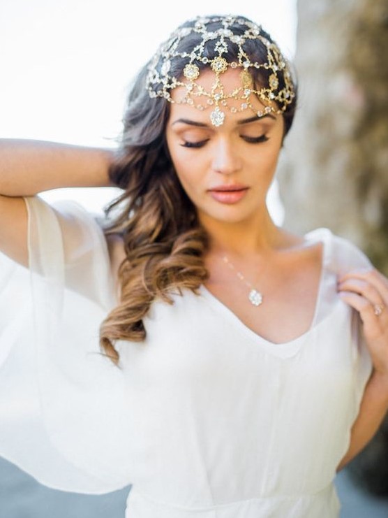 a gold chain headpiece wiht lots of pendants is a great fit for a Moroccan boho bride
