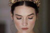 a gold flower and pearl bridal crown is a gorgeous idea for a wedding, ti will add a glam feel to the look instantly