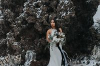 a gorgeous halter neckline mermaid wedding dress with a lace tail by Monique Lhuillier