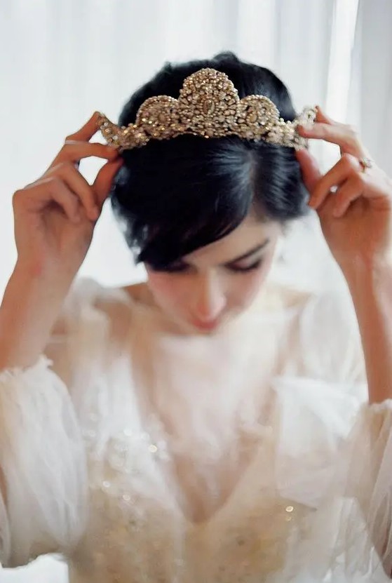 a heavily embellished bridal tiara will make a bold statement, you won't need other accessories