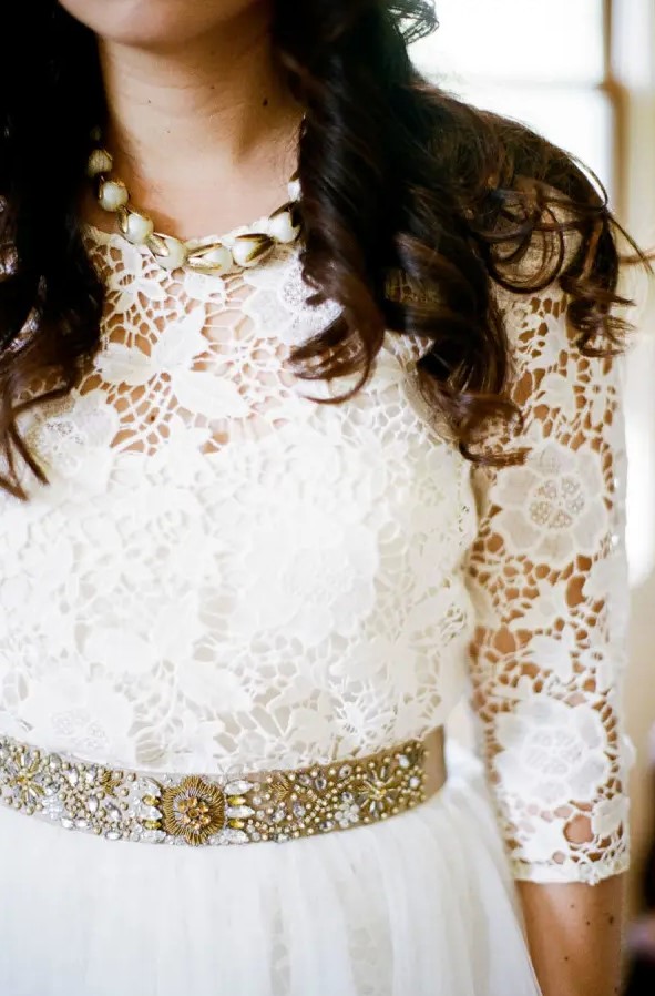 a heavily embellished gold belt makes the transition from the lace bodice and a ruffle skirt easier