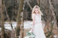 a lace illusion bodice and sleeve A-line wedding dress with a train for a princess-style look