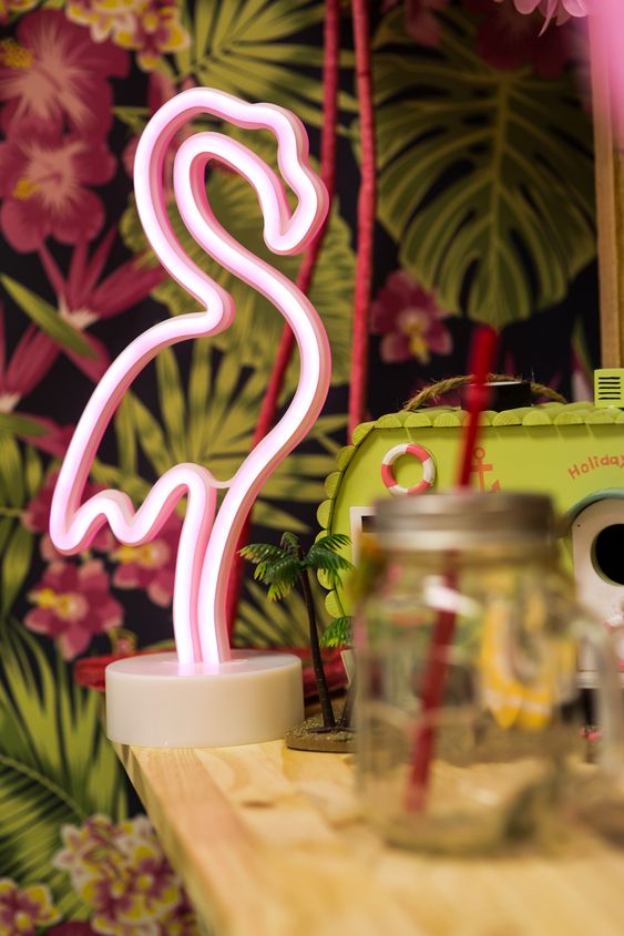 a pink flamingo neon sign is a cool and modern decor idea for any kind of modern tropical or beach wedding, and it will add a party feel