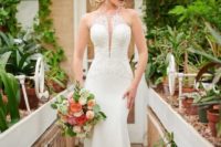 a sexy sheath wedding dress with a lace halter neckline bodice and a plain skirt with a train