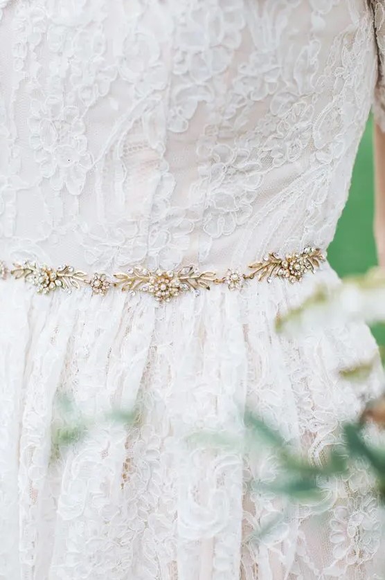 a very delicate gold and rhinestone bridal belt accents the dress and highlights your waist
