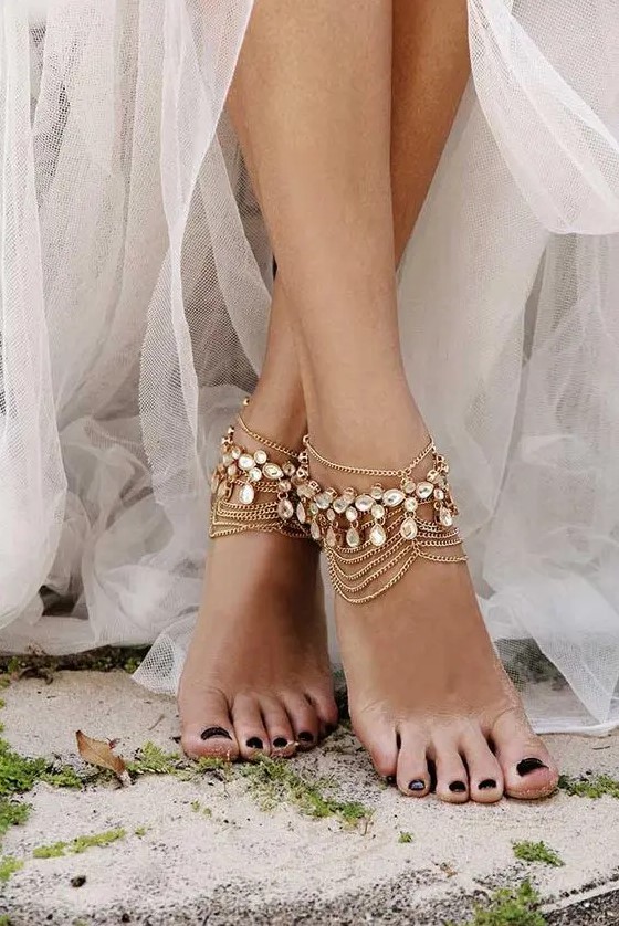 boho bridal anklets of multiple layer chains and rhinestones for a boho feel at the wedding