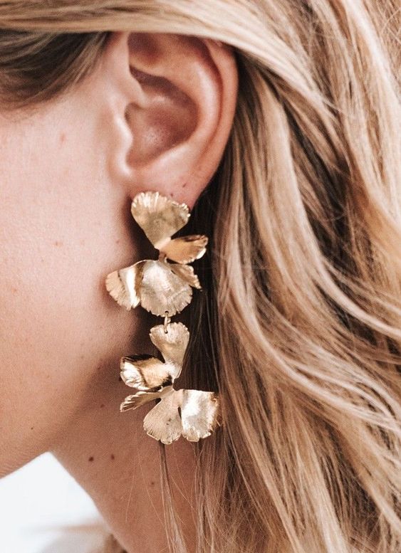 bold statement gold floral earrings are amazing for a wedding, they will add a delicate and refined feel to your look