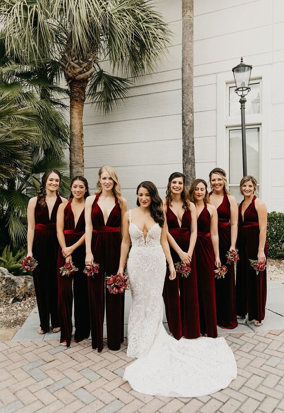burgundy velvet jumpsuits with deep necklines look very refined and very chic