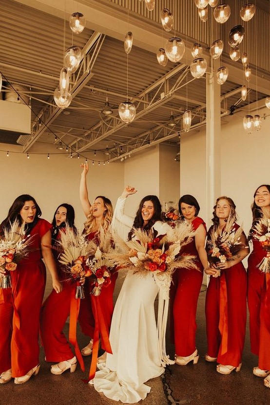 deep red jumpsuits with cap sleeves and wideleg pants and white platform shoes for boho bridesmaids