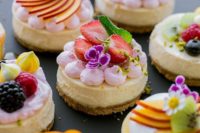 delicious mini cheesecakes with fresh strawberries, mint, meringues are amazing, go for a whole assortment